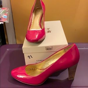 Coach patent pumps